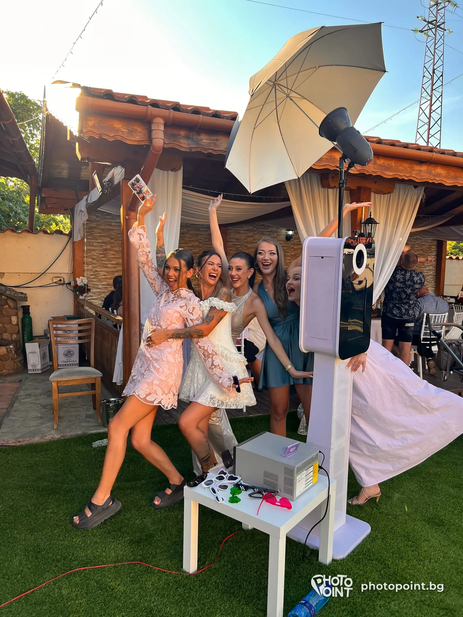 Cheerful guests dancing in front of PremiumPoint in a garden