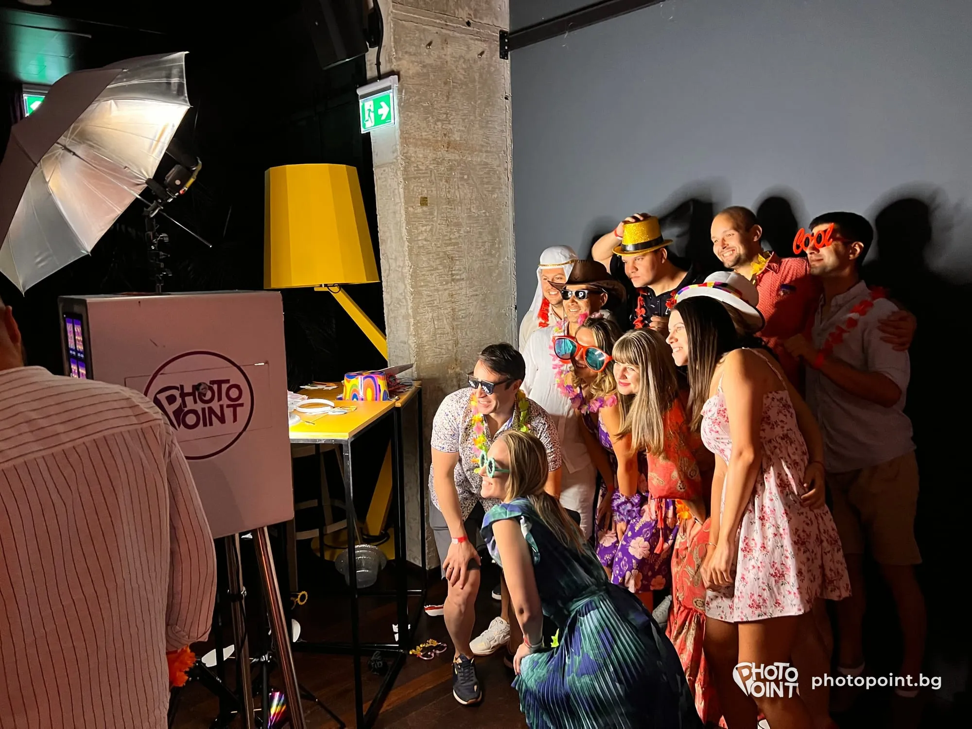 Colleagues in costumes having their photo taken at a themed company party