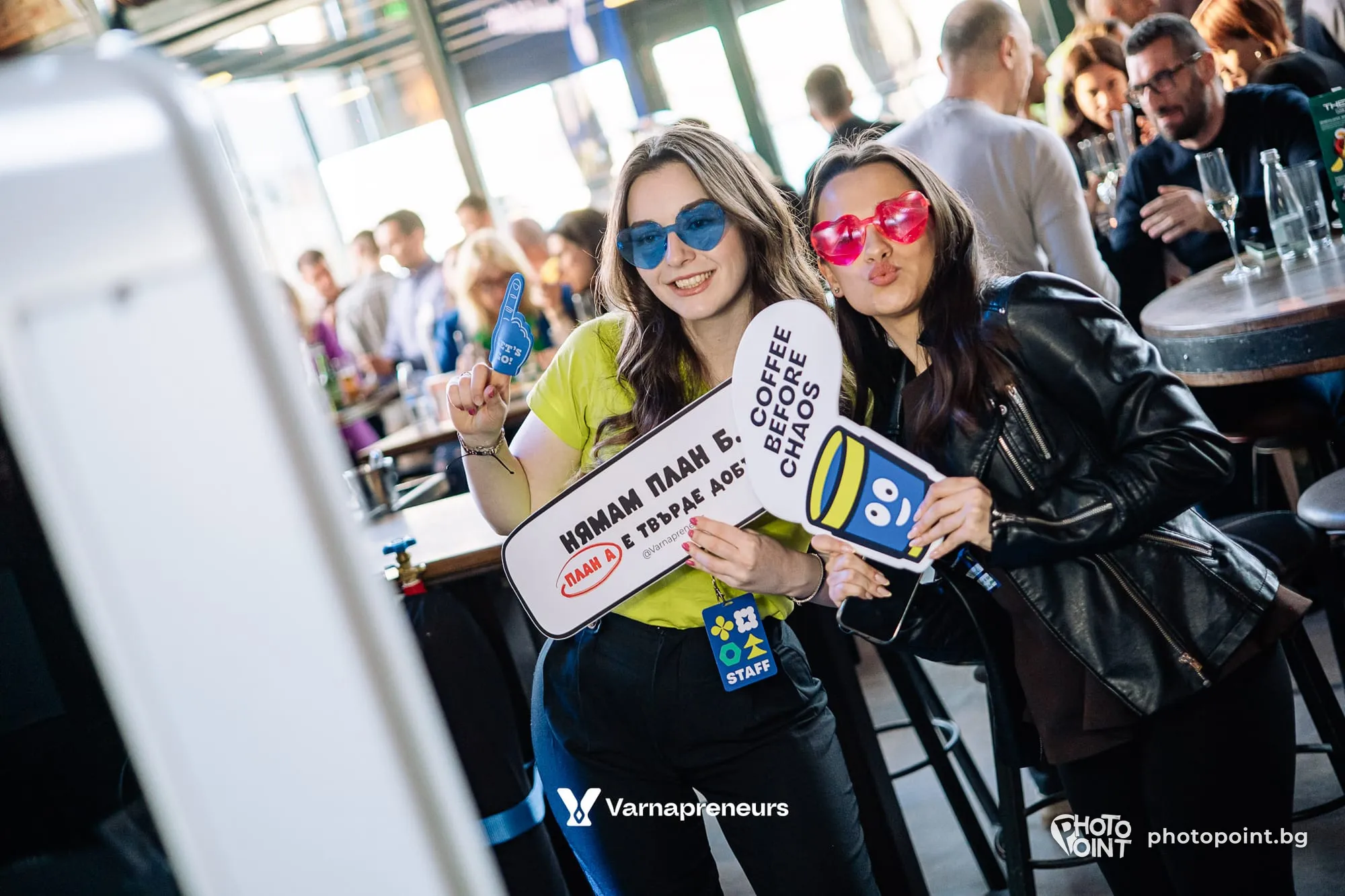 Guests with signs at a business community's birthday